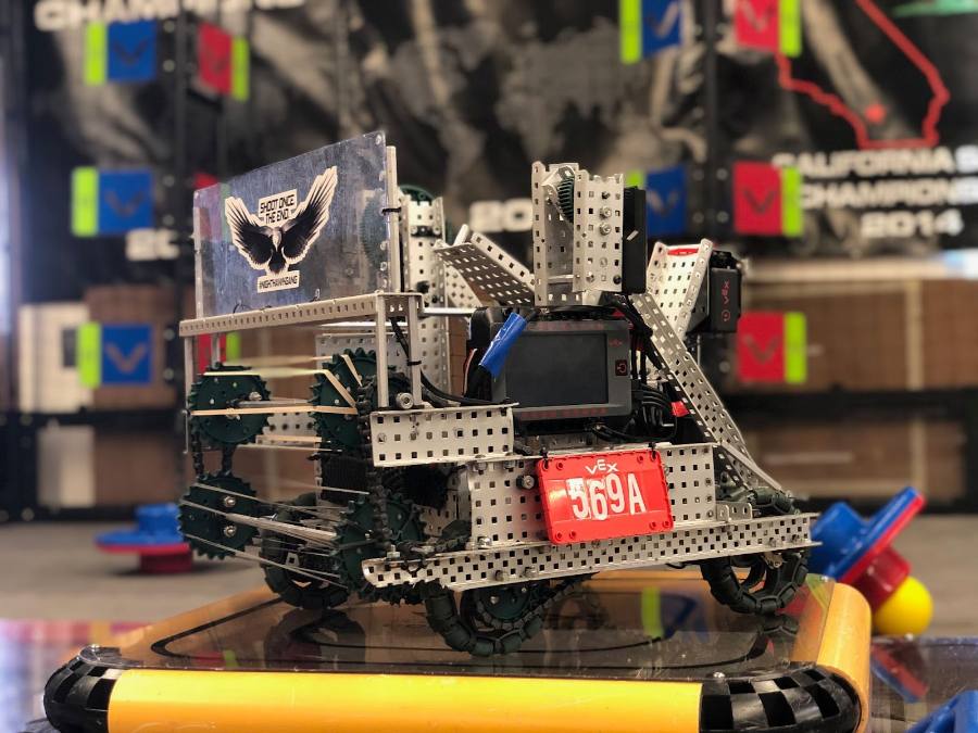 VEX competition robot on a padded field tile